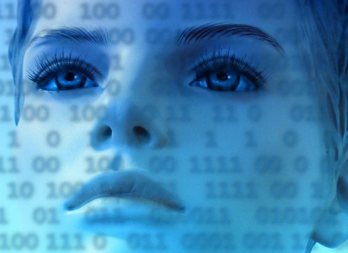Image of woman's face overlaid with binary code.